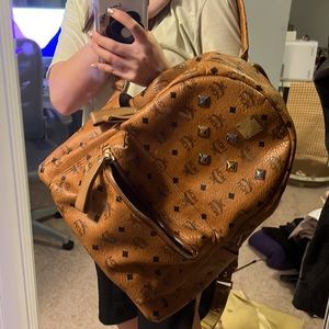 MCM medium size backpack . brown. used not new.